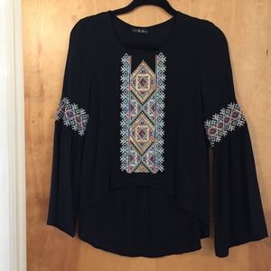 Blouse with embellished stitching